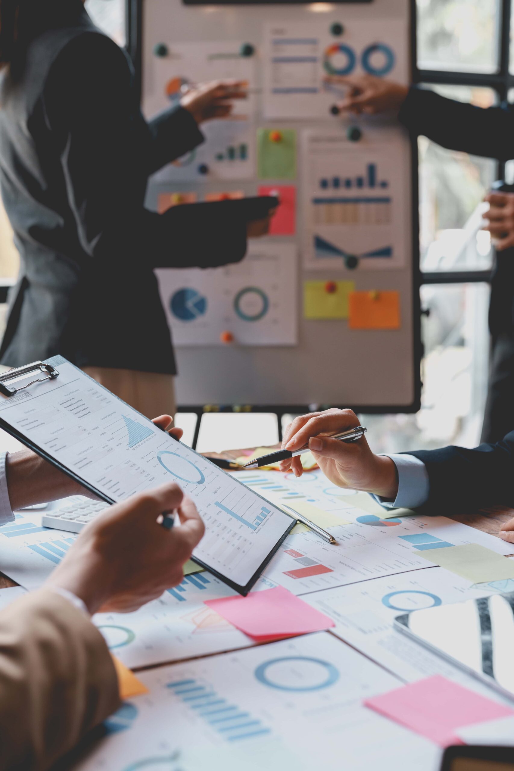 Group of Business people meeting creative planning and development strategy using graphs, charts, presented at company sales strategy marketing meeting.